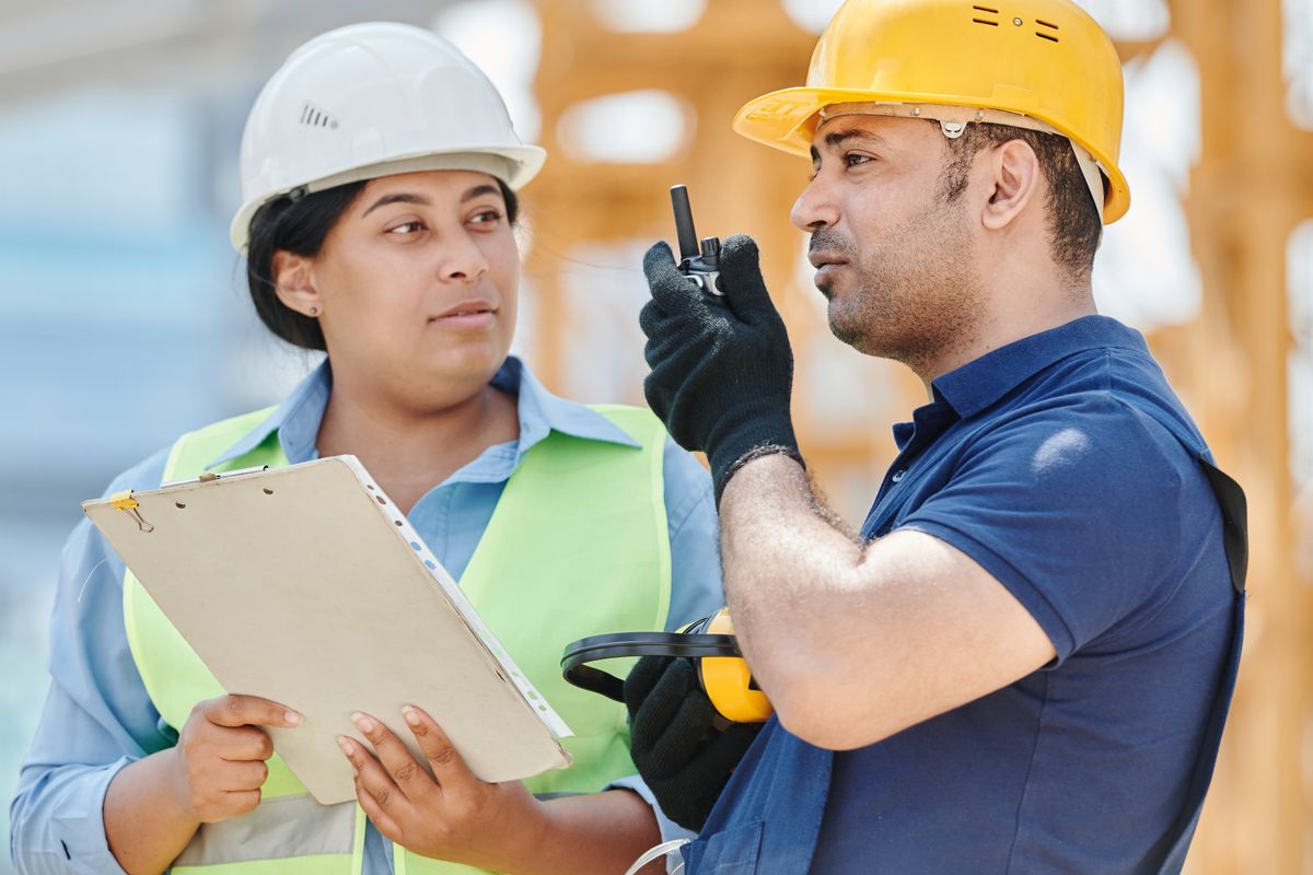 Site supervisors reviewing work on a federal jobsite